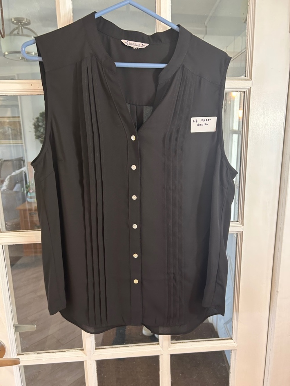 L7. Sleeveless Black Button-Front Pleated Blouse